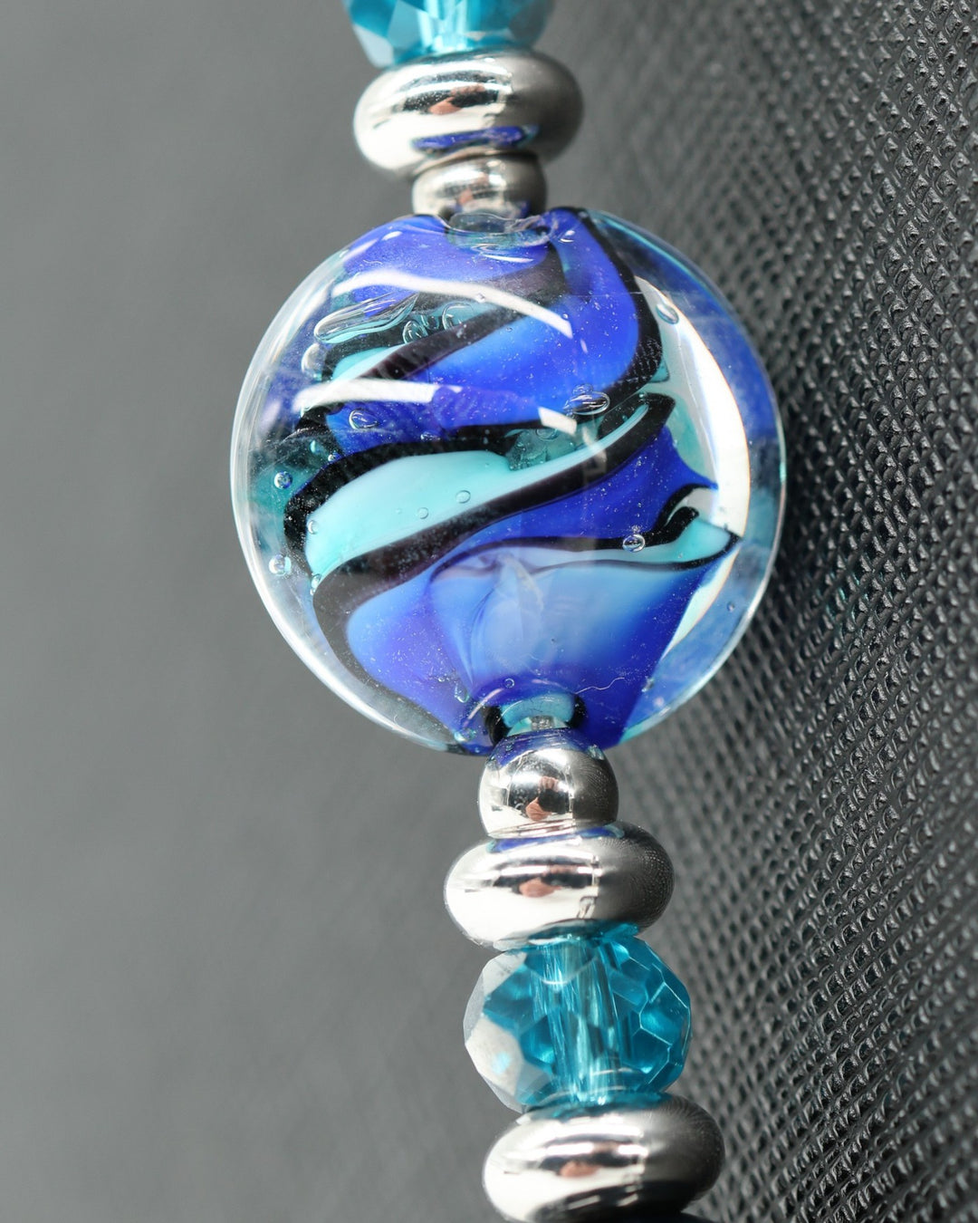 LD Keyfinder Ocean Mosaic artisan glass bead with blue swirls, teal crystal, and platinum-plated spacers