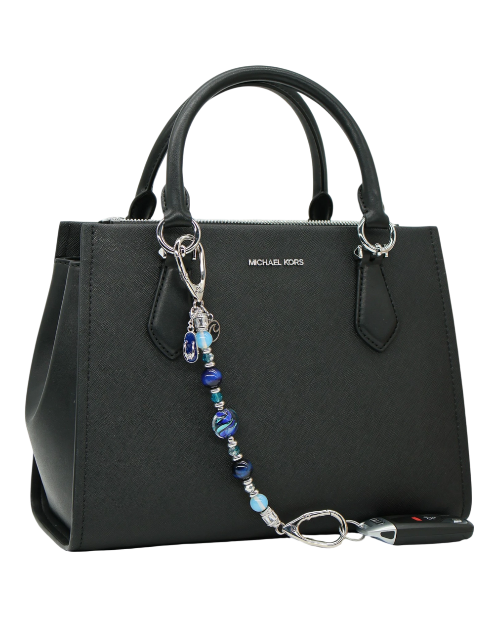LD Keyfinder Ocean Mosaic beaded accessory with artisan glass, tiger eye, and charms attached to a black handbag