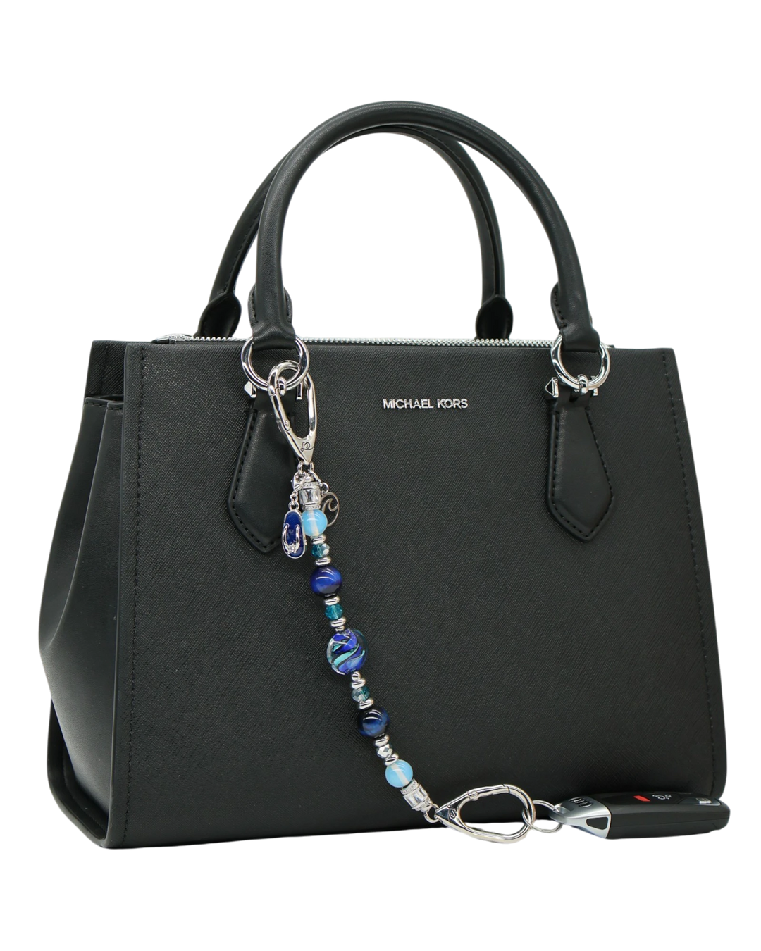 LD Keyfinder Ocean Mosaic beaded accessory with artisan glass, tiger eye, and charms attached to a black handbag