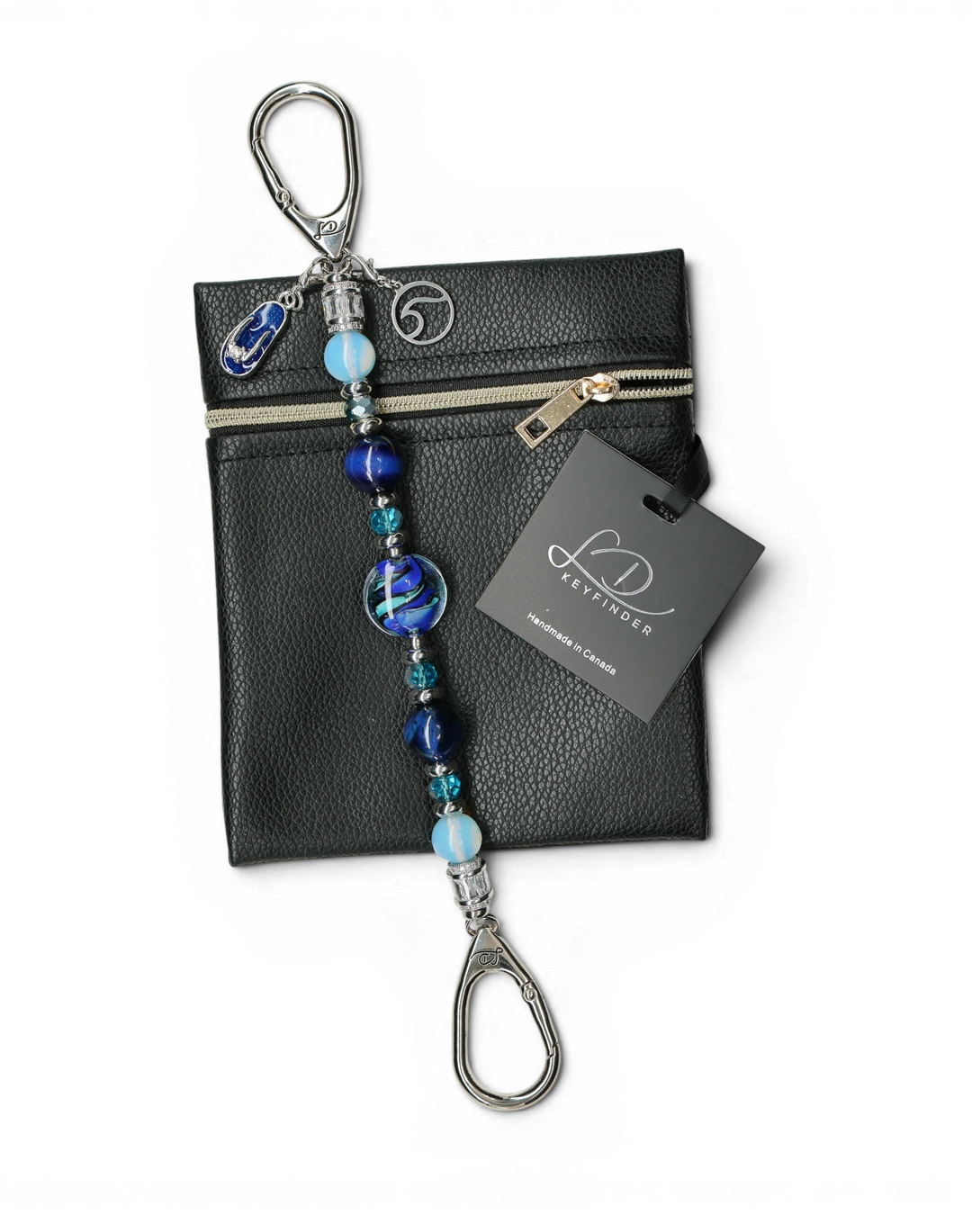 LD Keyfinder Ocean Mosaic beaded keychain with blue tiger eye, opalite, and artisan glass beads on a black pouch.