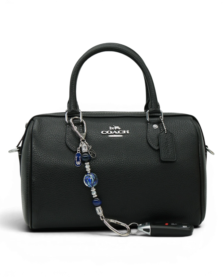 LD Keyfinder Ocean Mosaic Petite beaded keychain with artisan glass and blue tiger eye beads attached to a black bag.