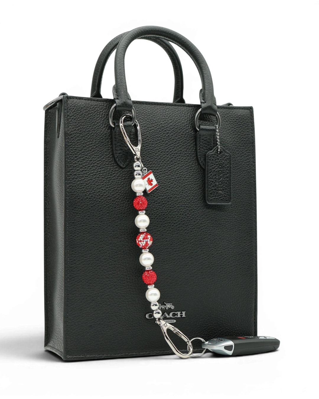 LD Keyfinder Oh Canada Shimmer keychain with red crystal, pearl, and glitter beads, and a Canada flag charm.