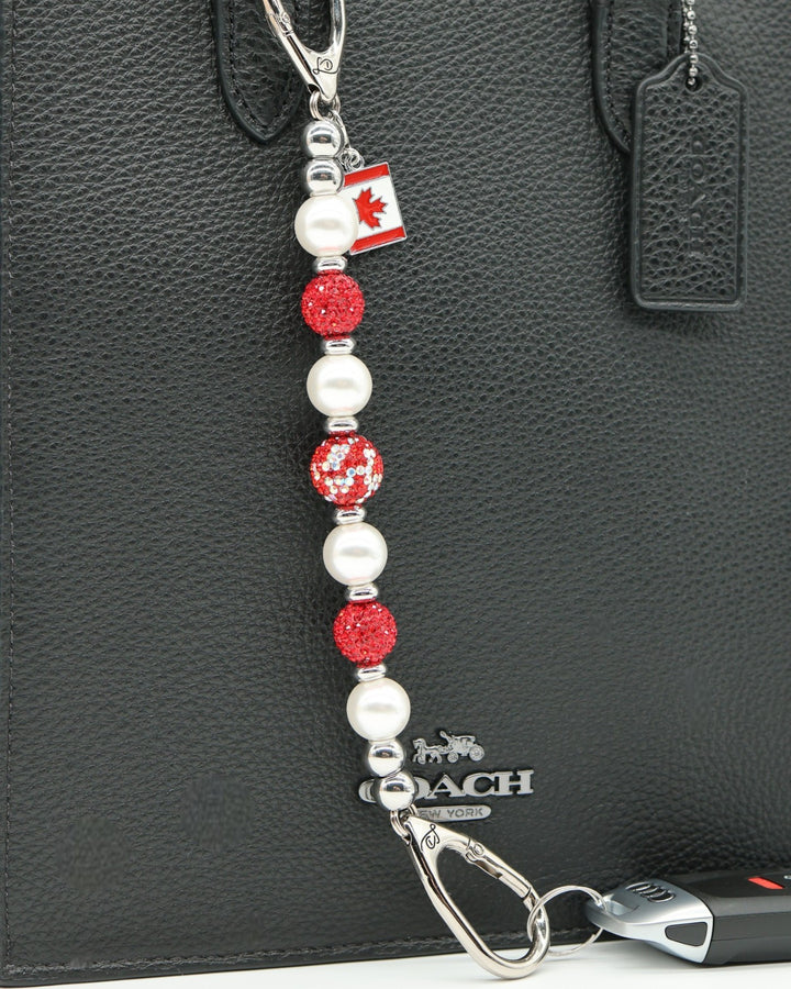 LD Keyfinder Oh Canada Shimmer keychain with red crystal and pearl beads, and a Canada flag charm.