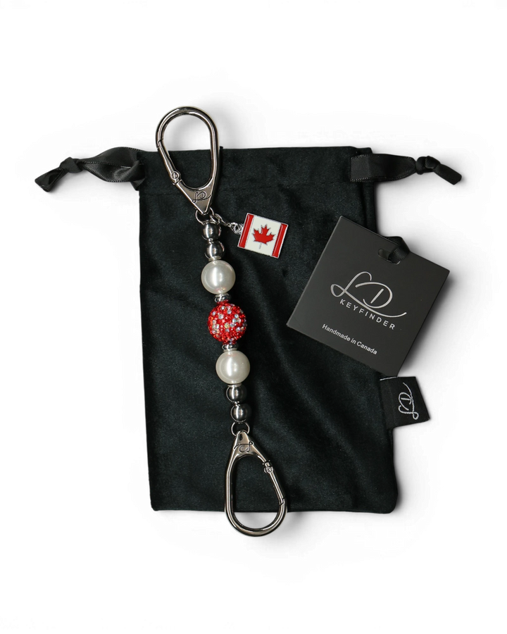 LD Keyfinder Oh Canada Shimmer Mini keychain with white pearls, red crystal bead, and Canada flag charm.