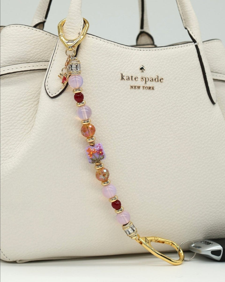 LD Keyfinder Opalite Bloom charm with pink opalite, ruby, and etched glass beads, and hummingbird charm.