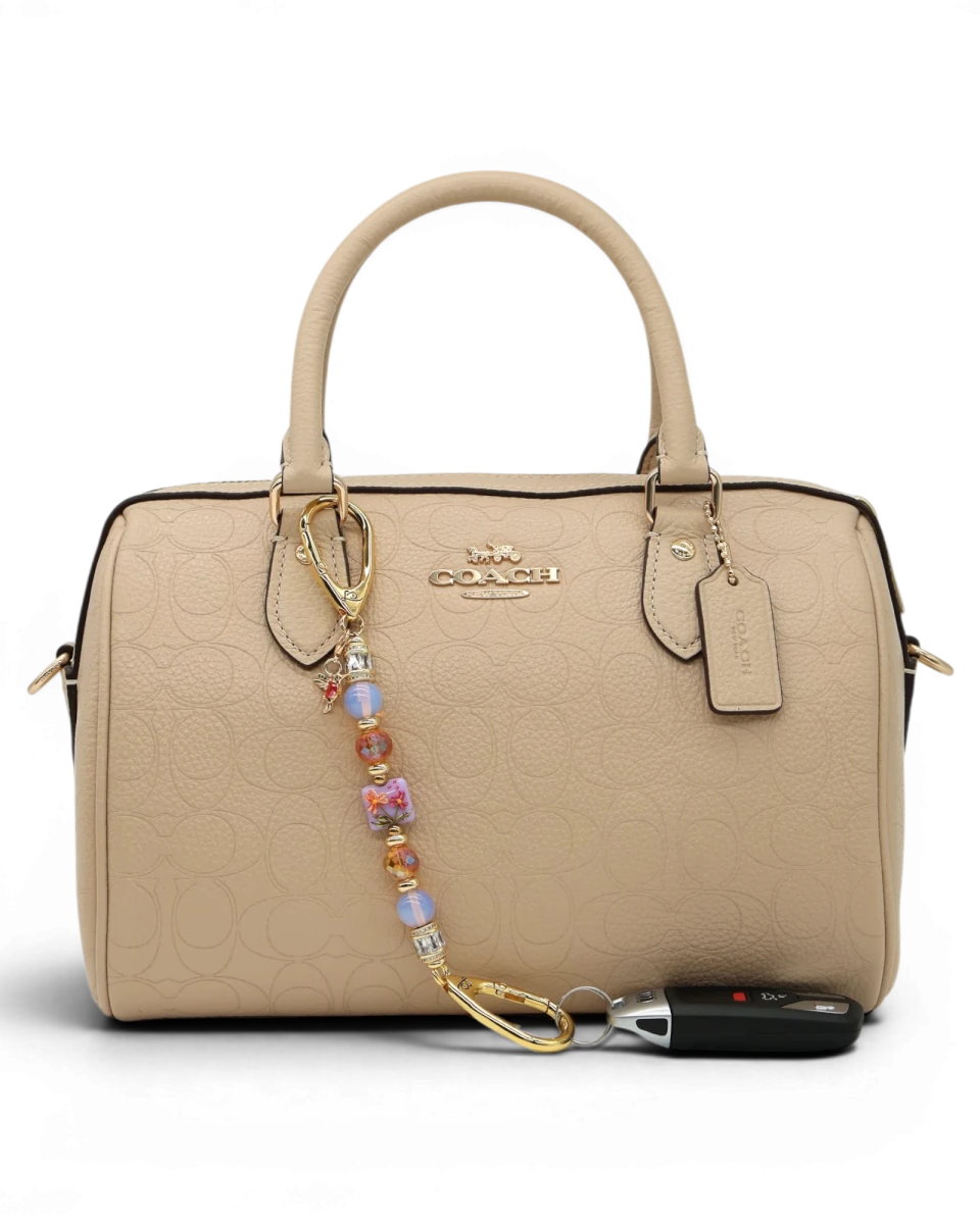 LD Keyfinder Petite Opalite Bloom keychain with pink opalite, burnt orange glass beads, and hummingbird charm.