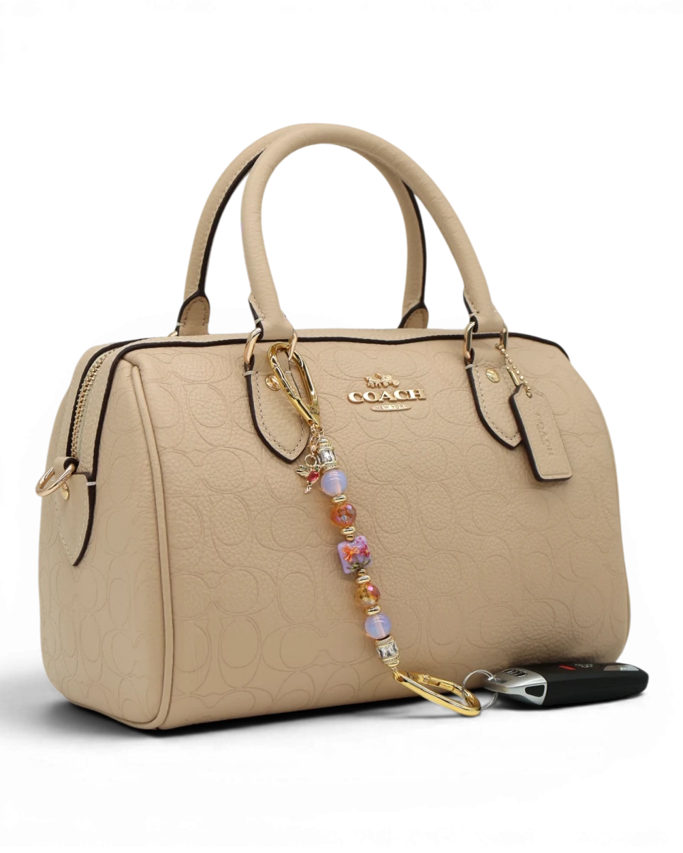 LD Keyfinder Petite Opalite Bloom keychain with pink opalite, burnt orange glass beads, and hummingbird charm.