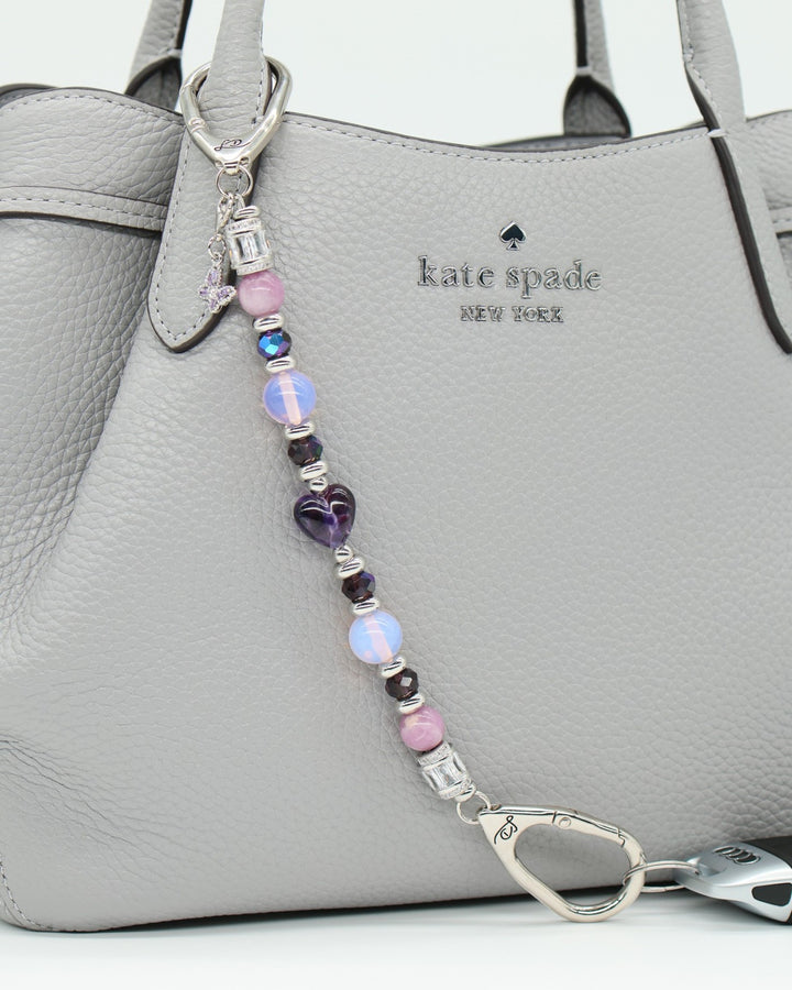 LD Keyfinder Orchid Flutter beaded accessory with lepidolite, opalite, and glass beads, featuring a butterfly charm.