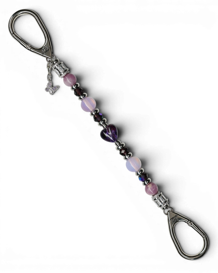 LD Keyfinder Orchid Flutter beaded accessory with lepidolite, opalite, glass beads, and a purple butterfly charm.