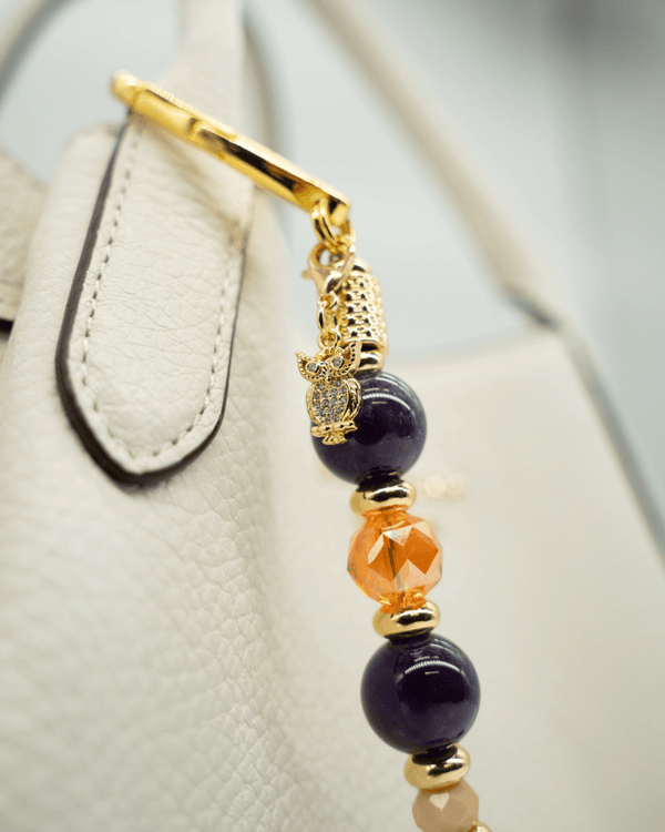 LD Keyfinder Whoo's There accessory with amethyst, orange glass, and peach jade beads featuring a gold owl charm.