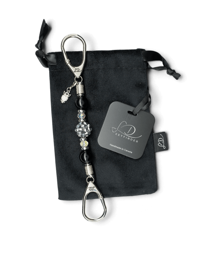 LD Keyfinder Owl That Glitters Mini with black obsidian, iridescent glass beads, and a sparkling owl charm on velvet