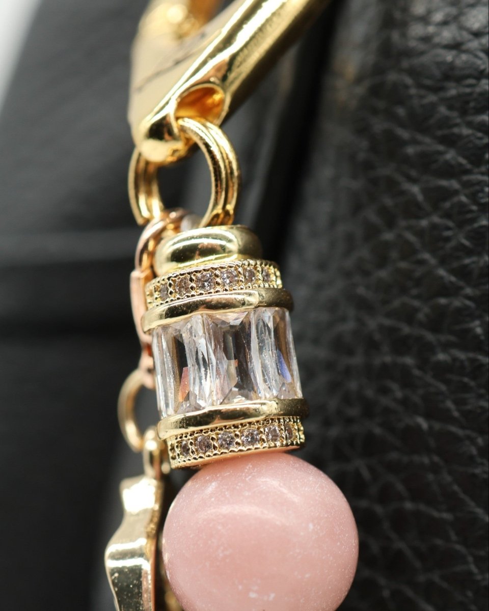 LD Keyfinder Pastel Garden charm bracelet with pink opal, pearls, aquamarine, and gold-plated details.