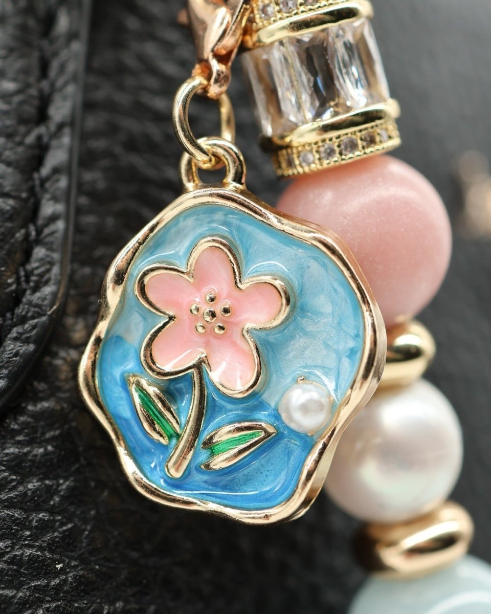 LD Keyfinder Pastel Garden charm with pink flower, blue enamel, pearls, aquamarine, and gold accents.