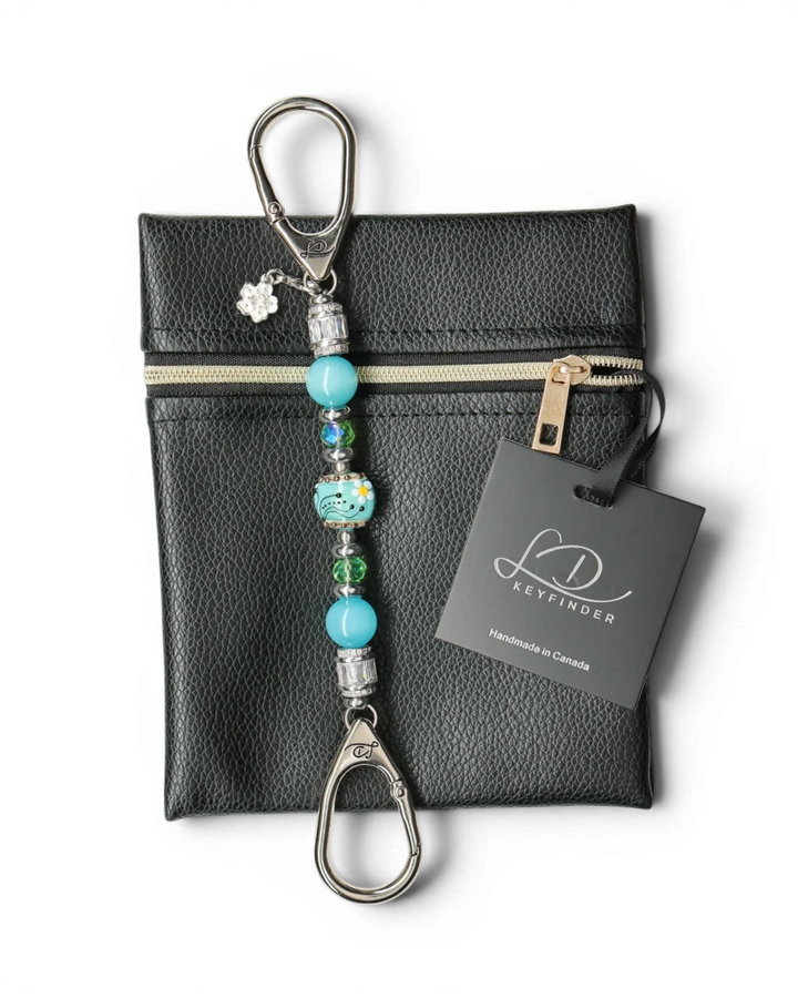 LD Keyfinder Petite Azure Meadow keychain with aqua blue cat's eye beads, green faceted glass beads, and a handcrafted lampwork glass daisy bead.