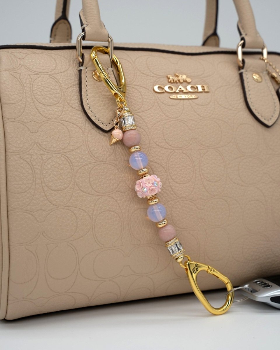 LD Keyfinder Petite Blush Sorbetto featuring pink opal, opalite, floral bead, and gold ice cream charm on a handbag