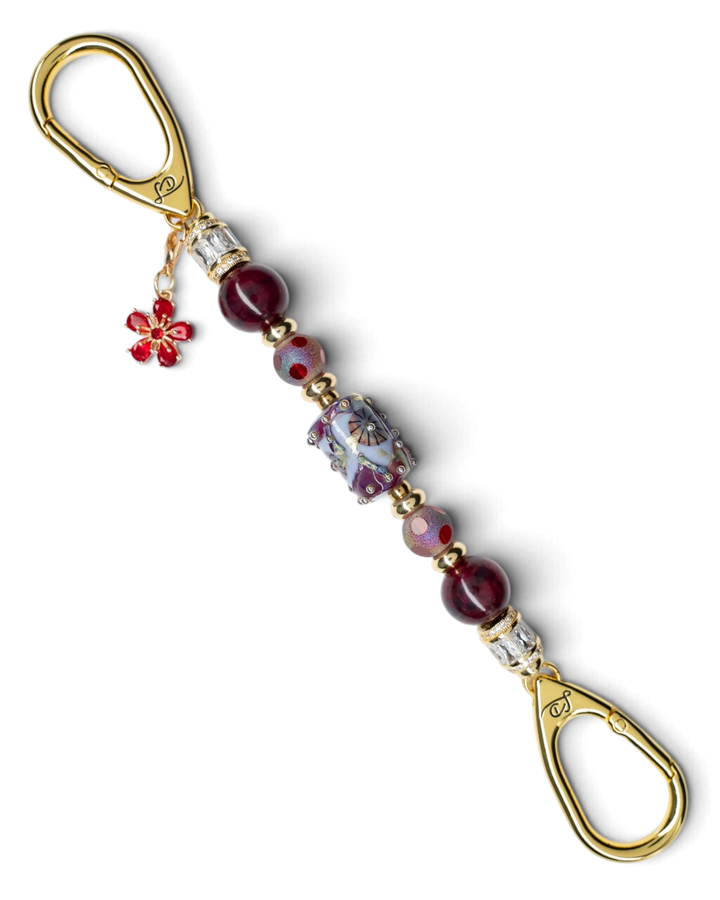 LD Keyfinder Petite Bordeaux Bloom featuring burgundy agate, artisan glass, gold-plated accents, and a red flower charm.