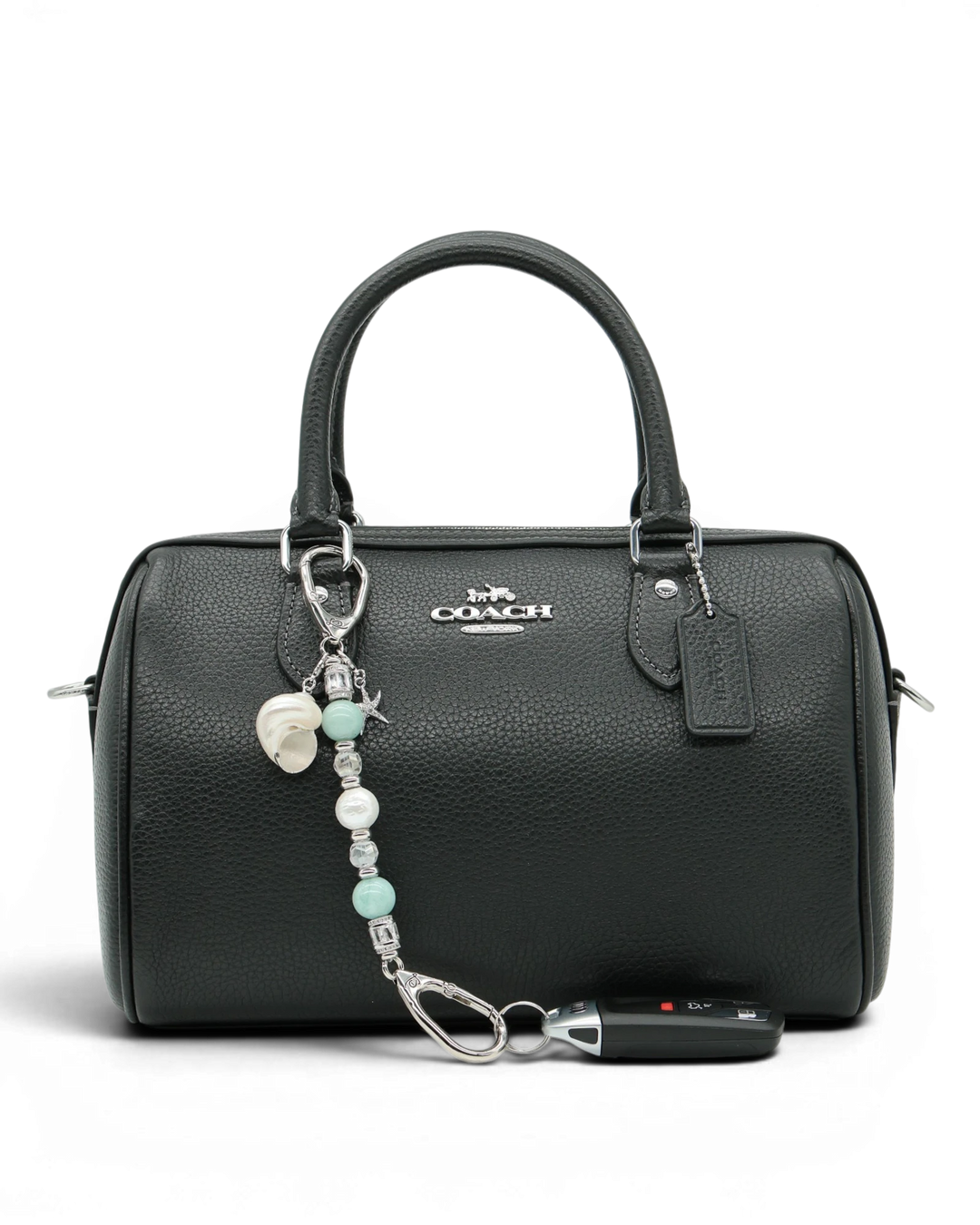 LD Keyfinder Petite Caribbean Pearl accessory with aqua jade, shell pearl, and starfish charm attached to a black bag