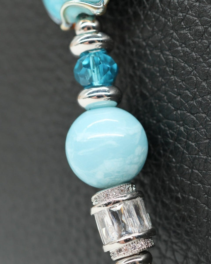 LD Keyfinder Petite Celestial Tide bracelet with turquoise, aqua, and silver beads, platinum-plated accents, and star charm.