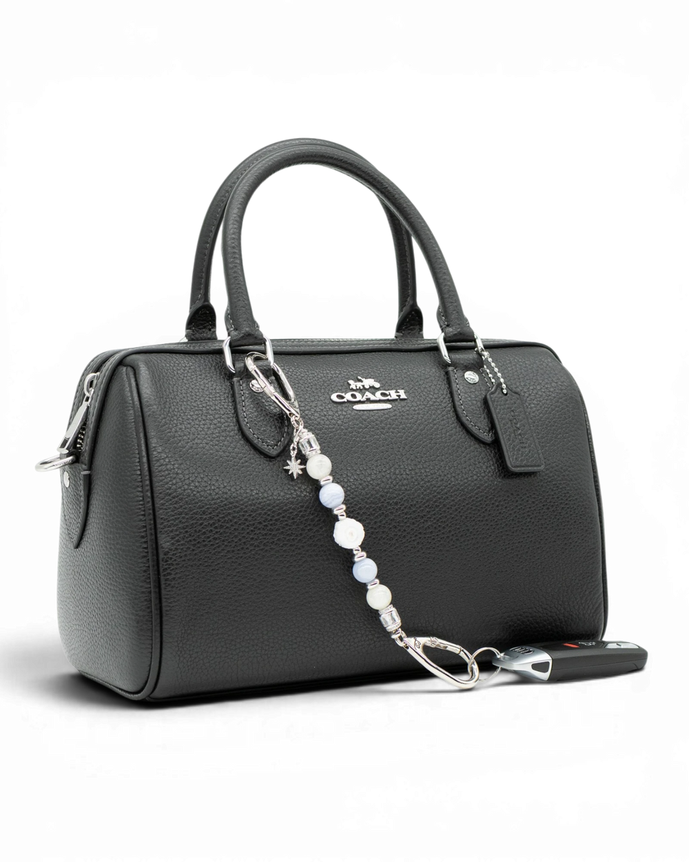 LD Keyfinder Petite Cloud Dancer beaded accessory with moonstone and blue lace agate attached to a black leather handbag