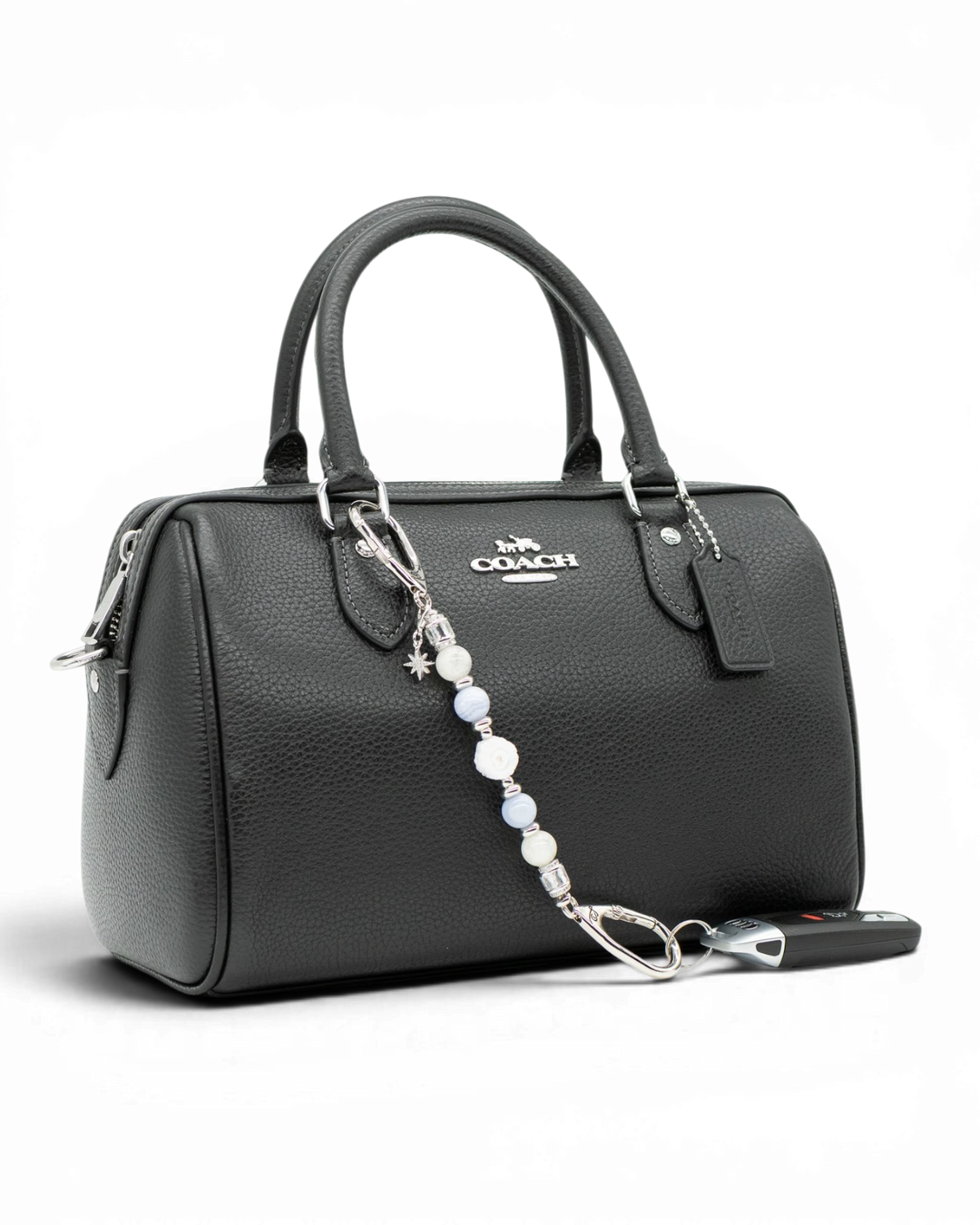 LD Keyfinder Petite Cloud Dancer beaded accessory with moonstone and blue lace agate attached to a black leather handbag