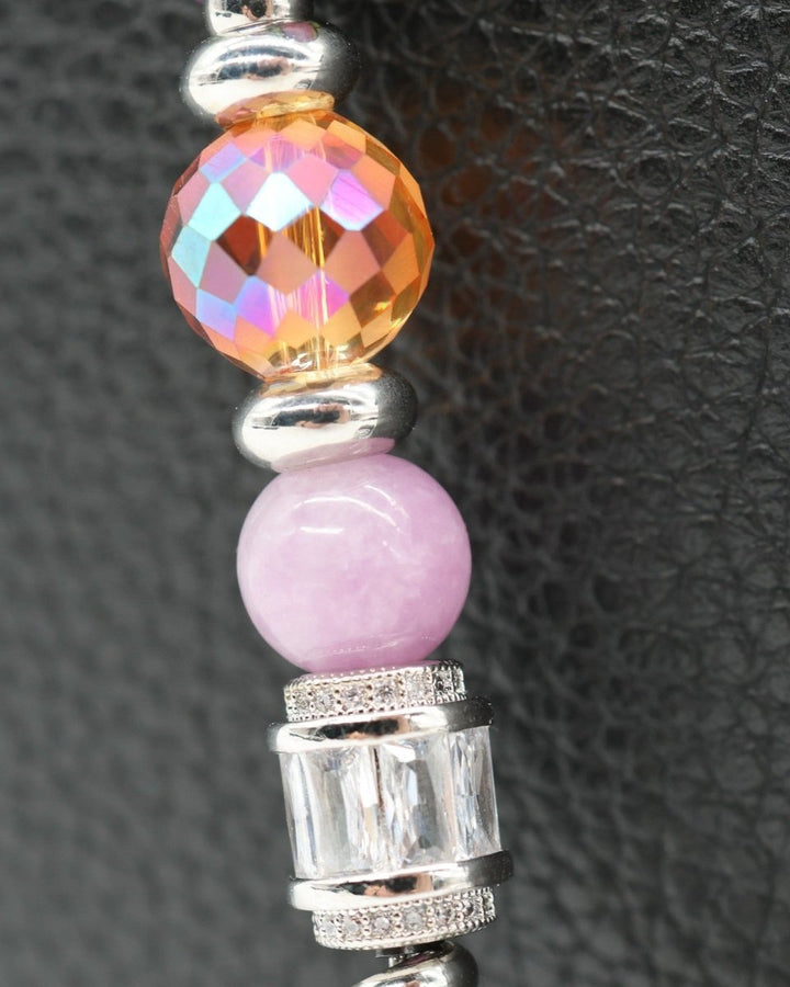 LD Keyfinder Petite Dragonfly Magic bracelet with purple lepidolite, orange faceted glass, and rhinestone dragonfly charm.