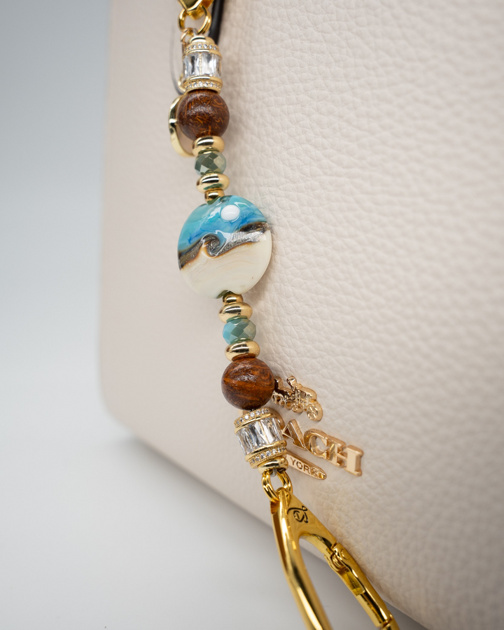 LD Keyfinder Petite Equinox Harmony featuring a handcrafted moon glass bead, jasper, blue jade, and gold-plated charms.