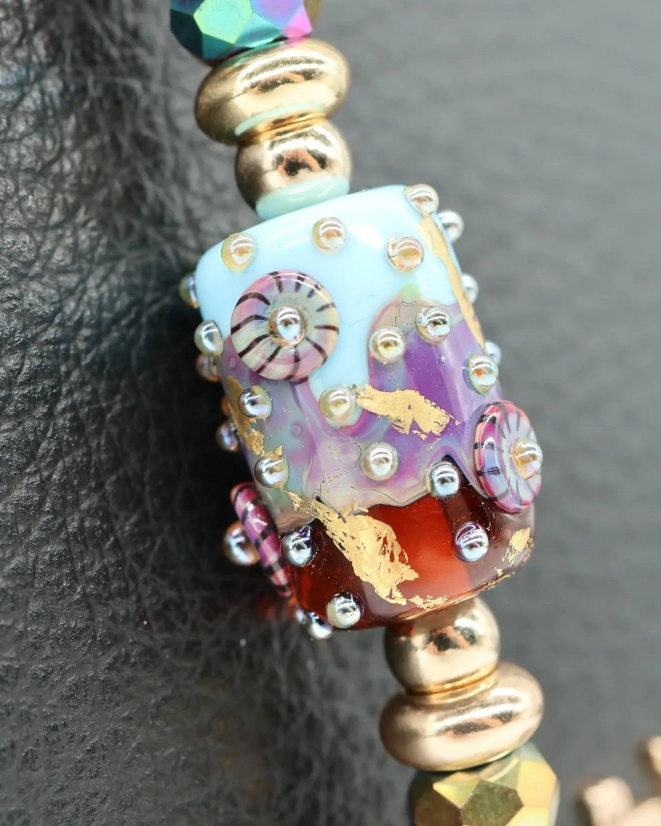 LD Keyfinder Petite Gilded Fantasy bracelet with handcrafted glass bead, sky blue, topaz, gold leaf, larimar, and gold-plated accents.
