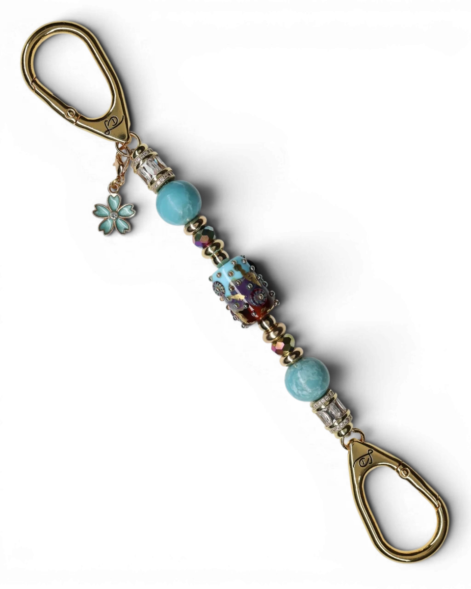 LD Keyfinder Petite Gilded Fantasy keychain with sky blue and topaz glass art bead, larimar, gold-plated accents, and flower charm.