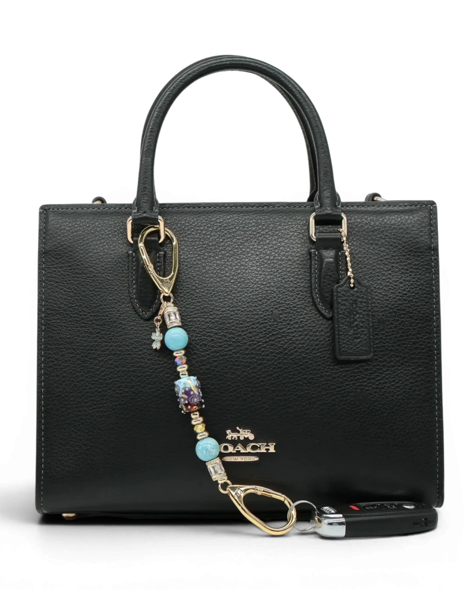 LD Keyfinder Petite Gilded Fantasy keychain with blue, gold, and topaz glass beads and a blue flower charm.