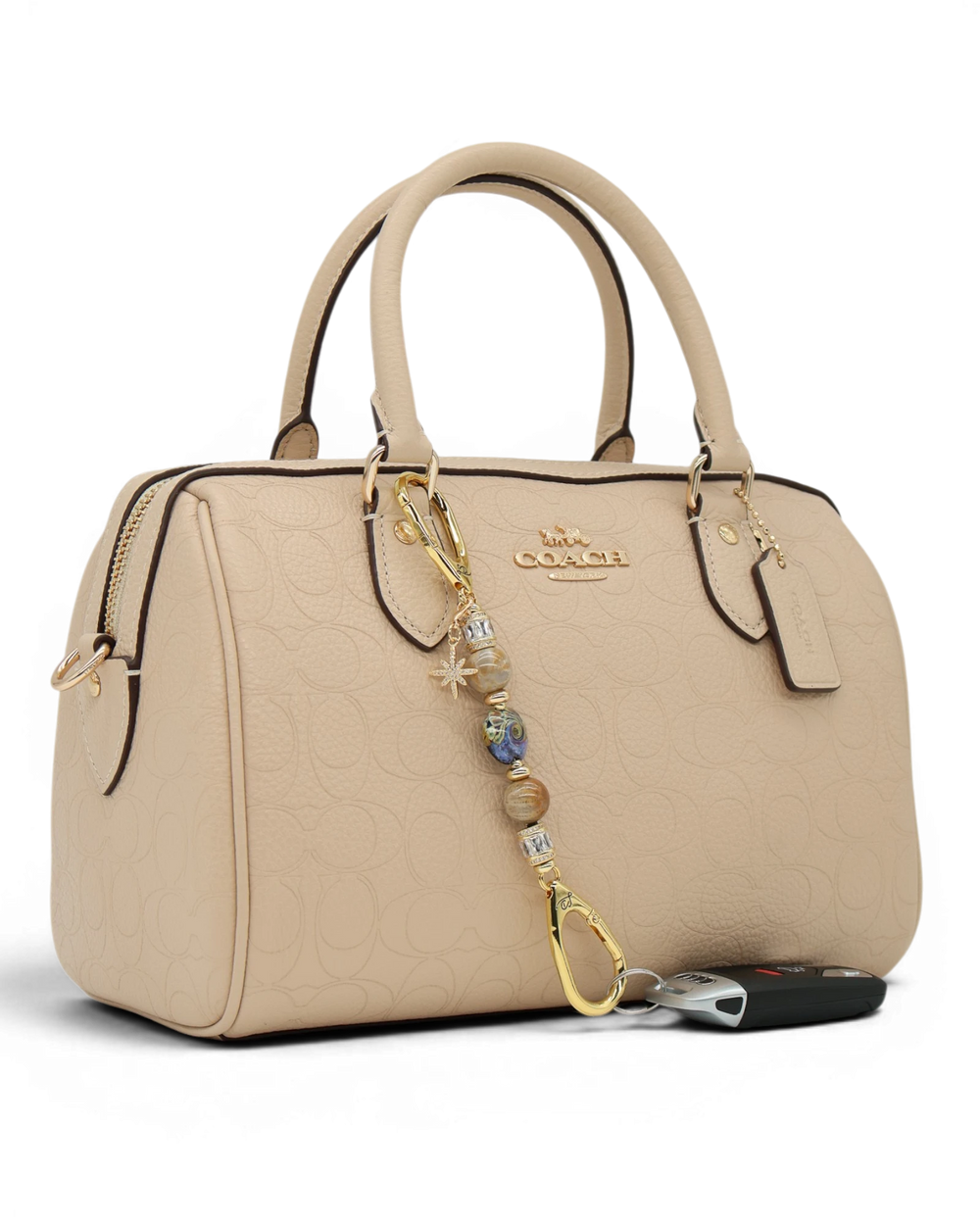 LD Keyfinder Petite Golden Nebula charm with purple, gold, and fossil coral beads, gold star charm, and gold hardware.