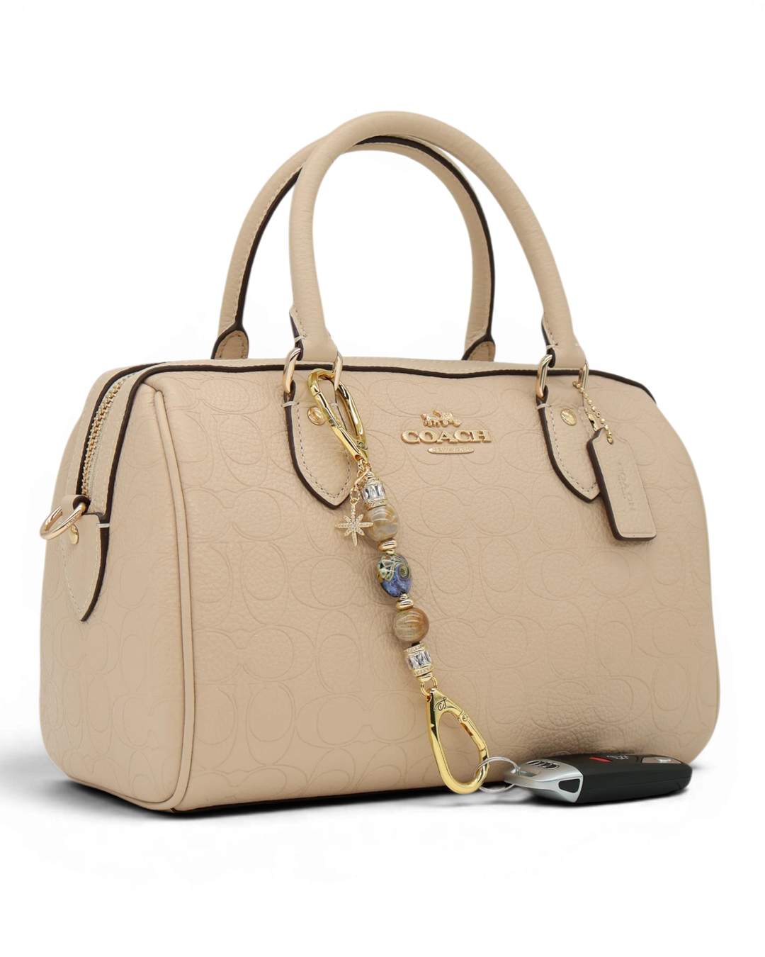 LD Keyfinder Petite Golden Nebula charm with purple, gold, and fossil coral beads, gold star charm, and gold hardware.