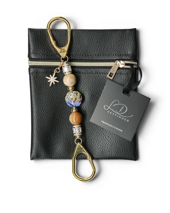 LD Keyfinder Petite Golden Nebula keychain with artisan glass bead, fossil coral, gold-plated spacers, rhinestones, and star charm.