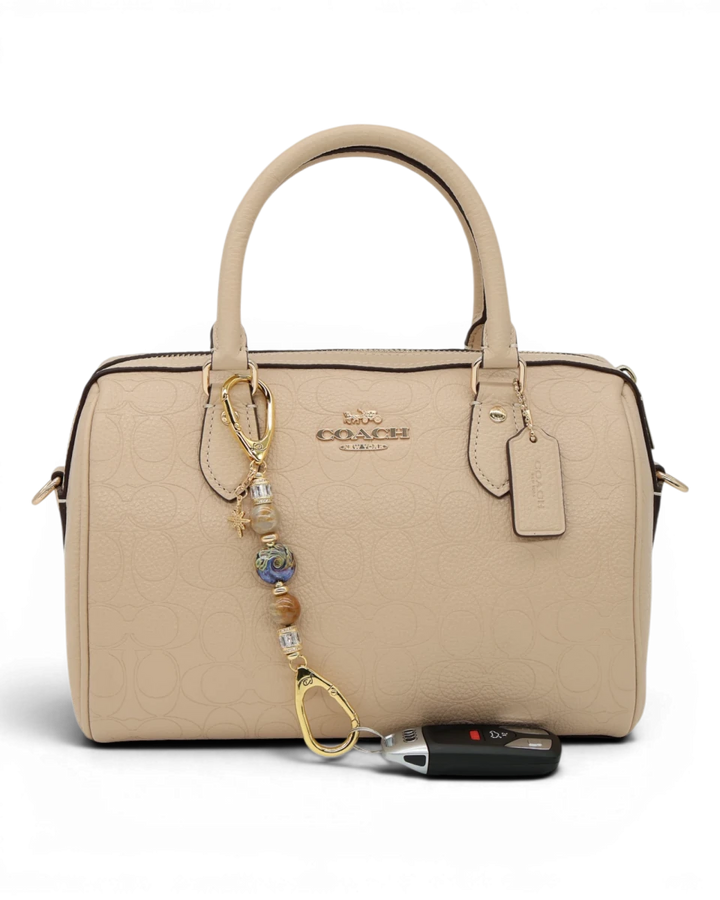LD Keyfinder Petite Golden Nebula keychain with artisan glass bead, fossil coral, gold-plated spacers, rhinestones, and star charm.