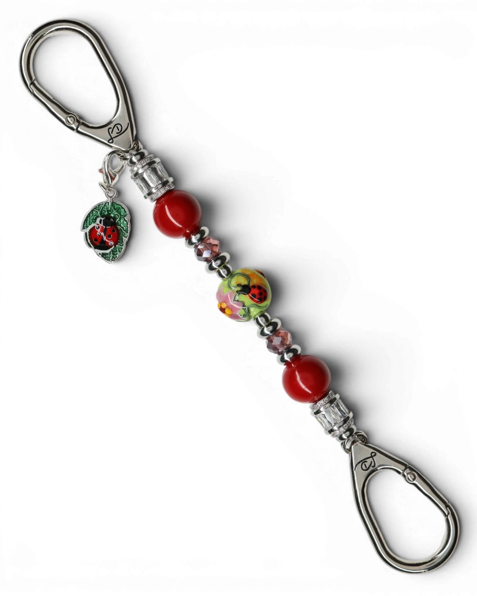LD Keyfinder Petite Ladybug Love key finder with artisan glass bead, red shell pearls, and silver-plated ladybug charm.