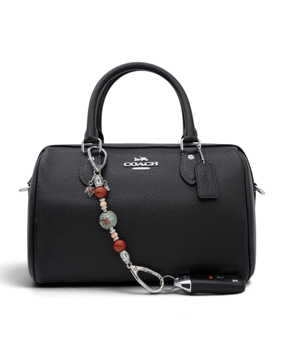 LD Keyfinder Petite Maple Majesty featuring red jasper, peach jade, and artisan glass beads attached to a black handbag.