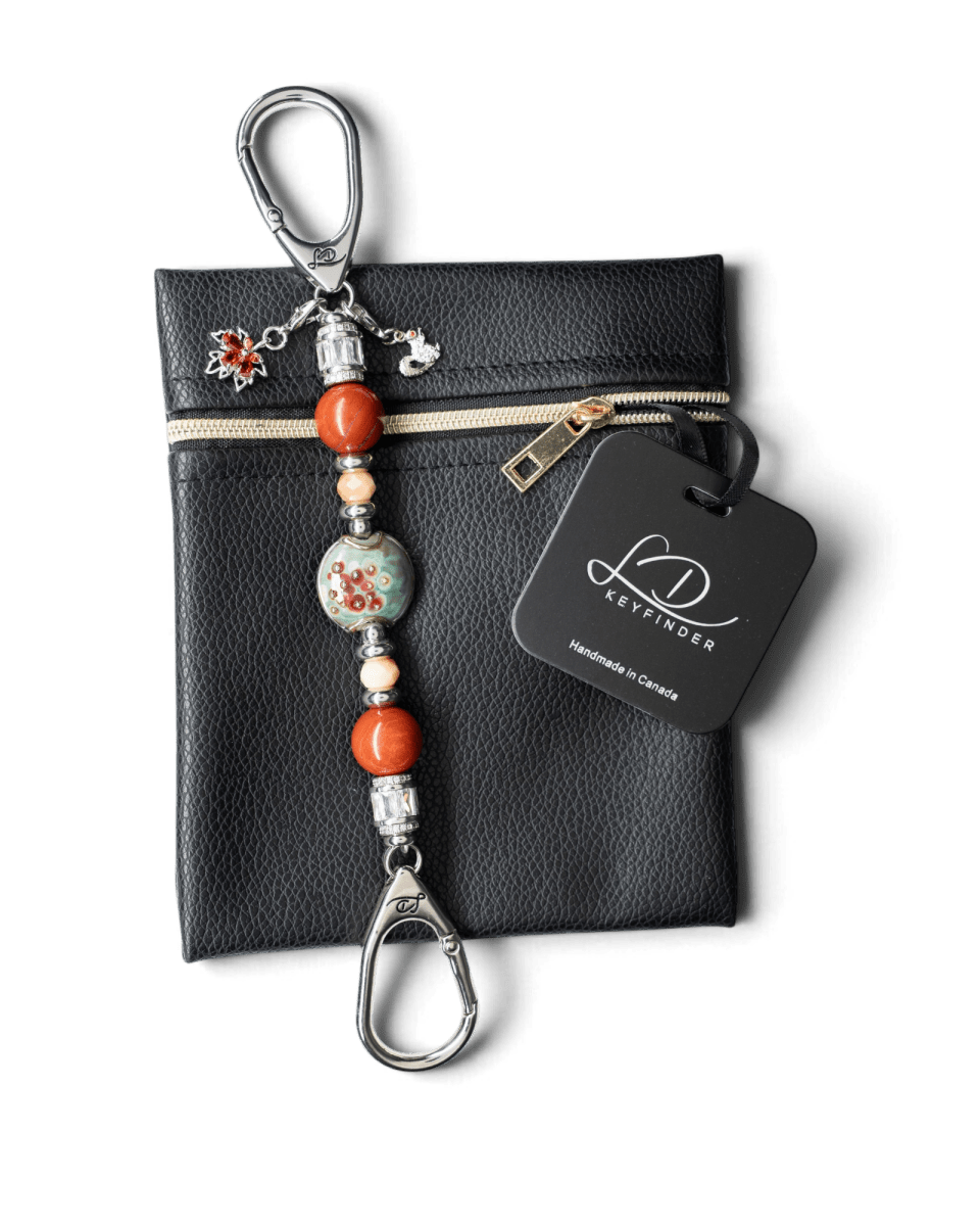 LD Keyfinder Petite Maple Majesty beaded keychain with artisan glass, red jasper, and autumn-themed charms on a pouch.