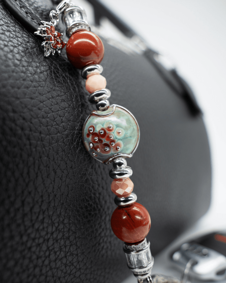 LD Keyfinder Petite Maple Majesty featuring red jasper, peach jade, artisan glass bead, and maple leaf charm.