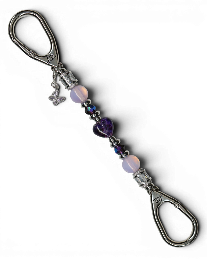 LD Keyfinder Petite Orchid Flutter with pink opalite, dark orchid glass beads, and a purple rhinestone butterfly charm.