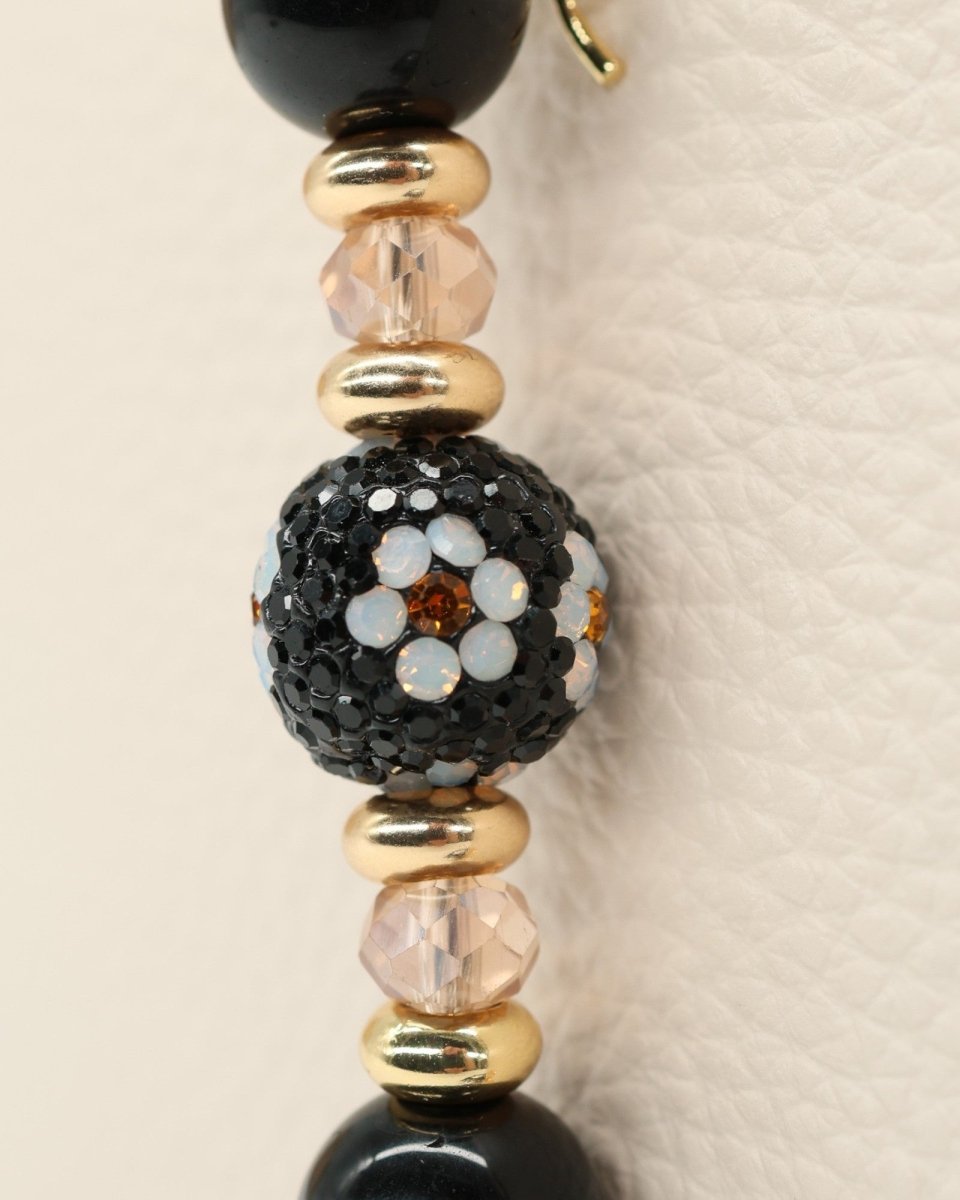 LD Keyfinder Petite Queen Bee II bracelet with black obsidian, crystal daisy bead, gold accents, and bumblebee charm.