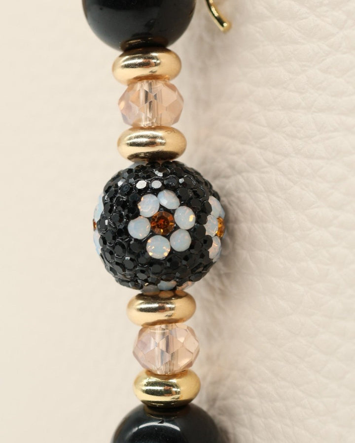 LD Keyfinder Petite Queen Bee II bracelet with black obsidian, crystal daisy bead, gold accents, and bumblebee charm.