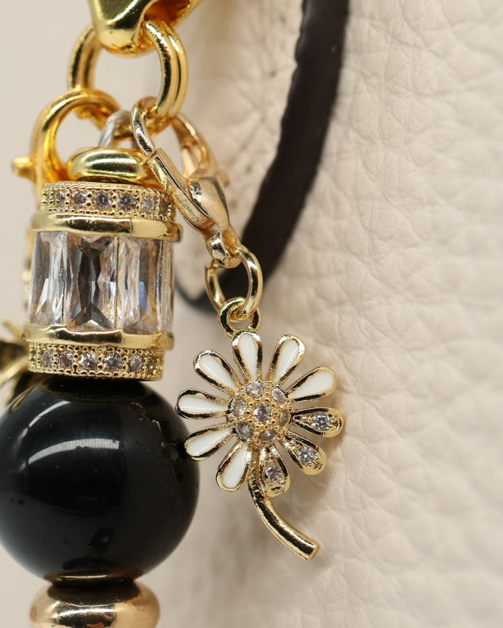 LD Keyfinder Petite Queen Bee II charm with black obsidian, gold accents, crystal daisy, and bumblebee.