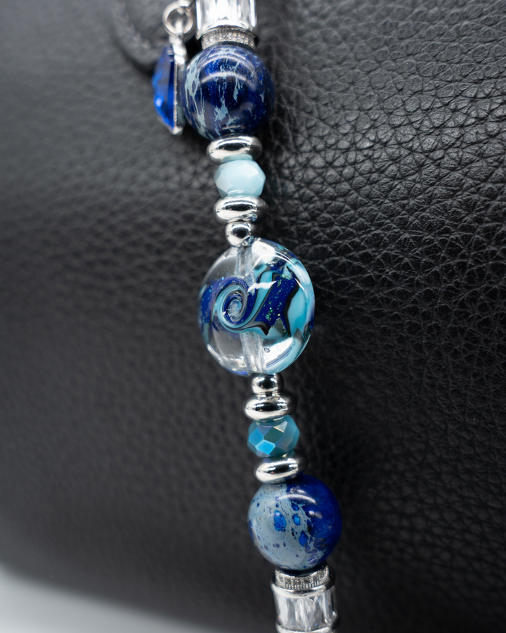 LD Keyfinder Petite Sapphire Allure featuring artisan blue glass, blue jasper, and platinum-plated accents on leather.