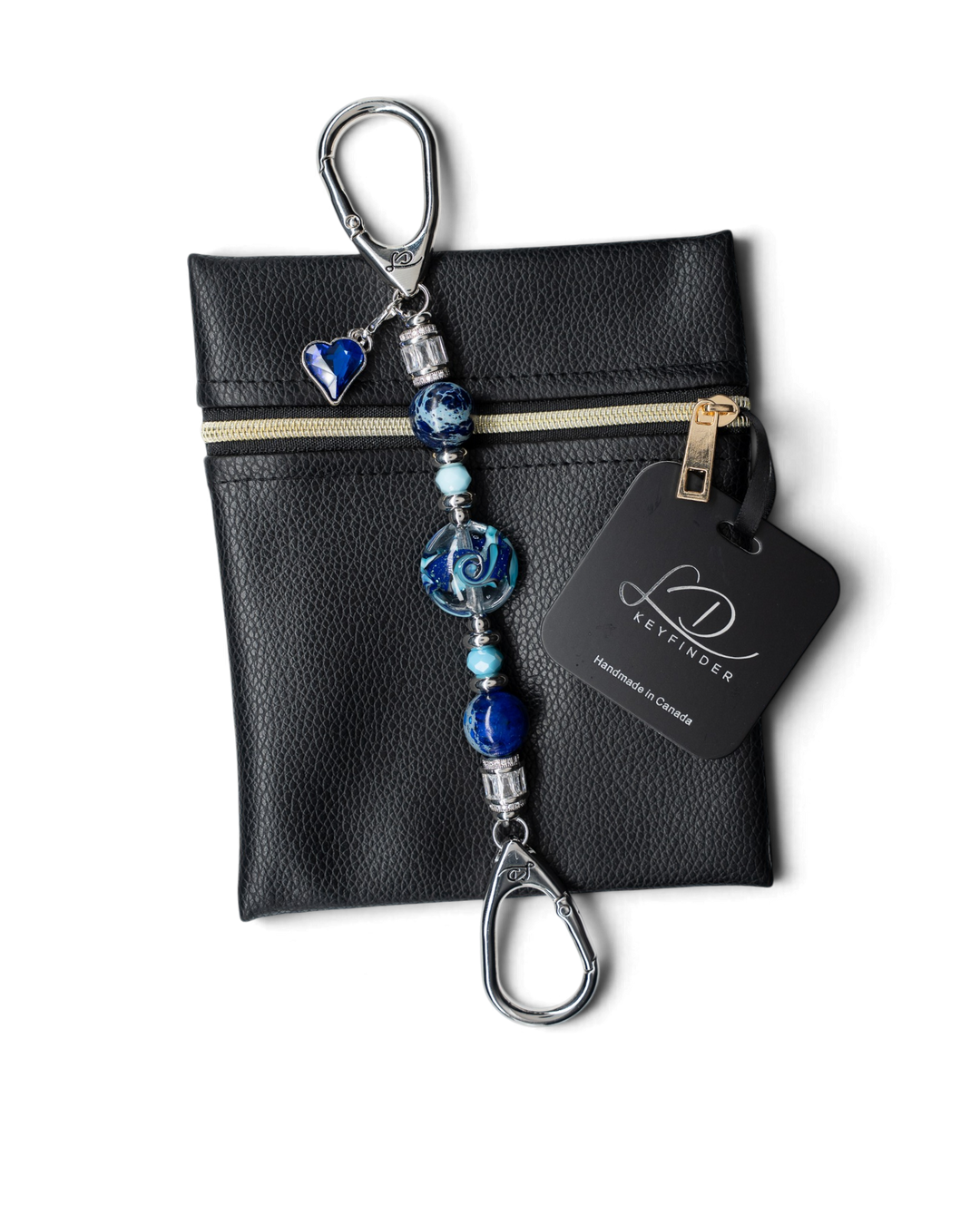 LD Keyfinder Petite Sapphire Allure featuring blue artisan glass, jasper beads, and a sapphire heart charm on a pouch.