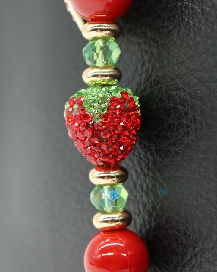 LD Keyfinder Petite Strawberry Fields keychain with red shell pearls, green glass beads, and crystal strawberry charm.