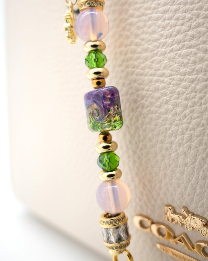 LD Keyfinder Petite Verdant Bloom featuring a handcrafted purple and green lampwork glass bead, pink opalite, and gold