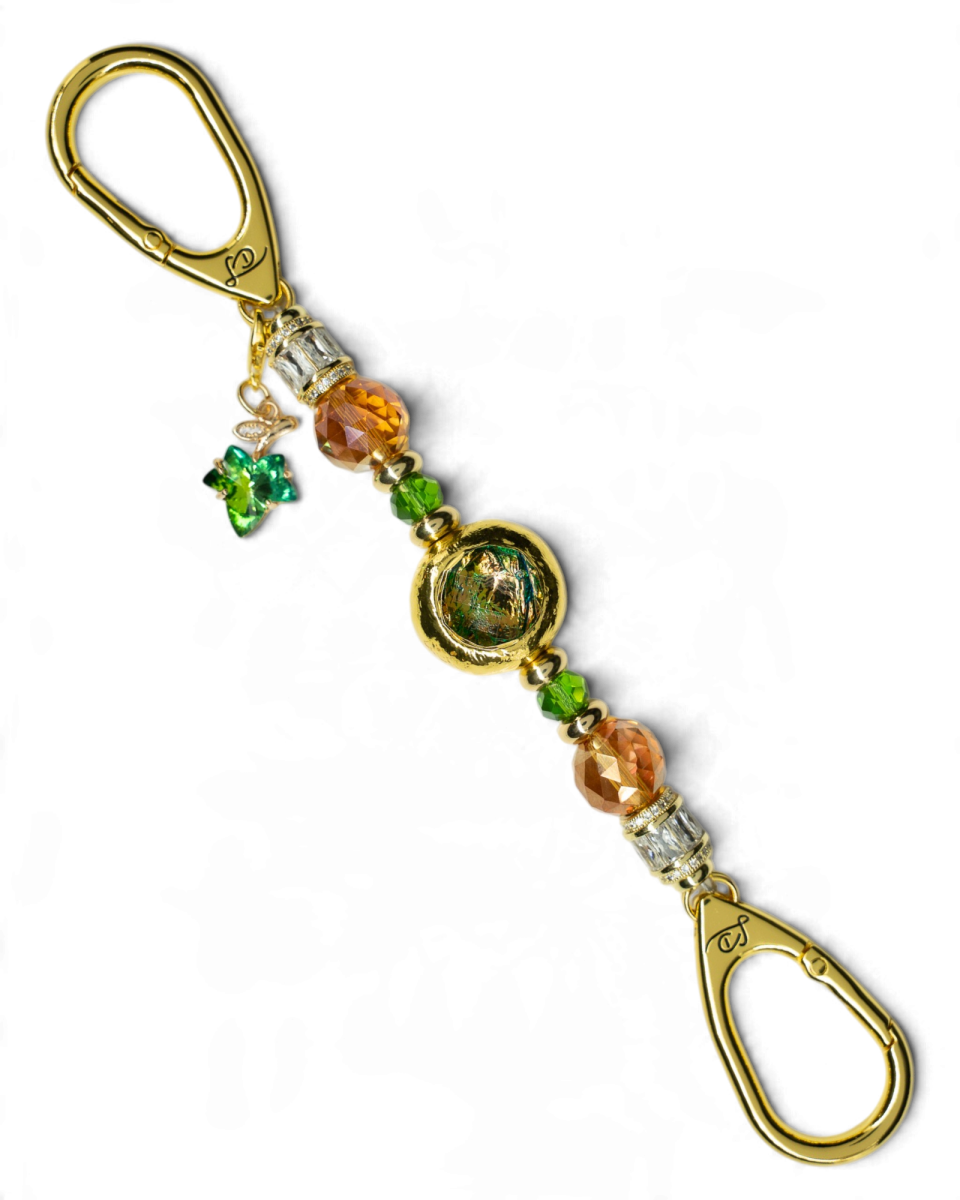 LD Keyfinder Petite Verdant Flame featuring orange and green glass beads, gold-plated accents, and a leaf charm.