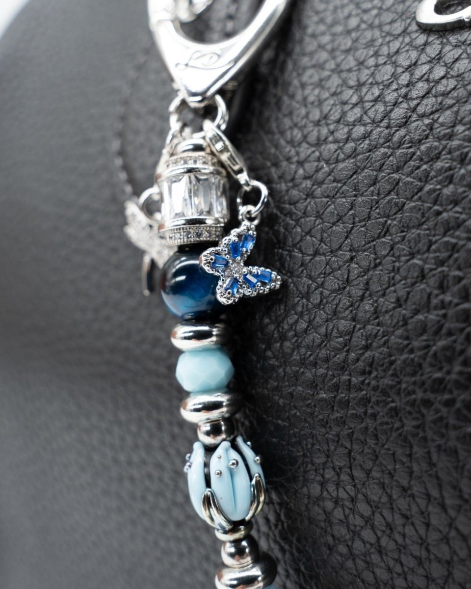 LD Keyfinder Petite Whispering Garden accessory with blue tulip glass bead, Blue Tiger Eye, and dragonfly charm.