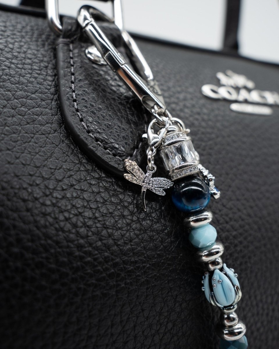 LD Keyfinder Petite Whispering Garden accessory featuring a blue artisan glass tulip, tiger eye beads, and dragonfly charm.