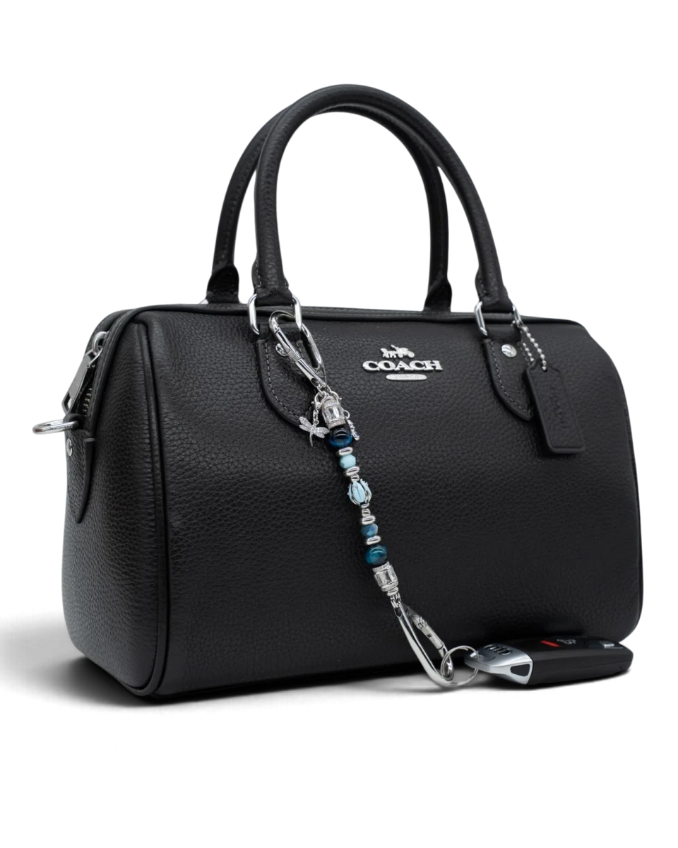 LD Keyfinder Petite Whispering Garden accessory featuring a blue glass tulip, tiger eye beads, and charms on a handbag