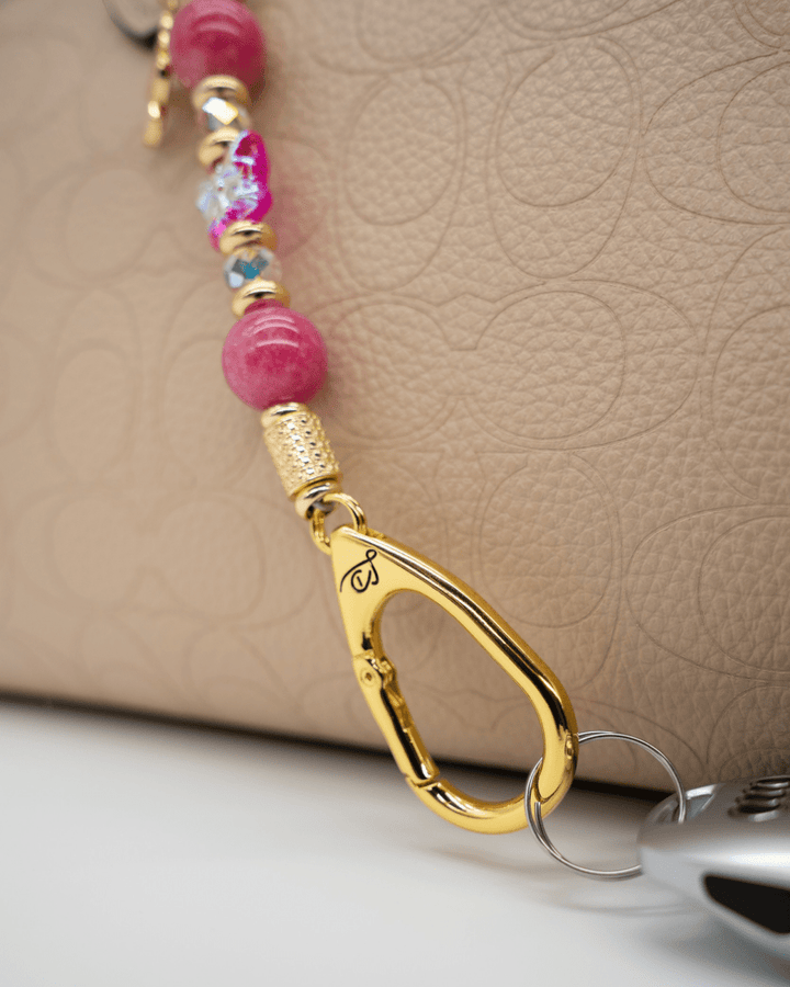 LD Keyfinder Wings of Hope Mini featuring pink jade beads, a hot pink butterfly charm, and 18KT gold-plated hardware.